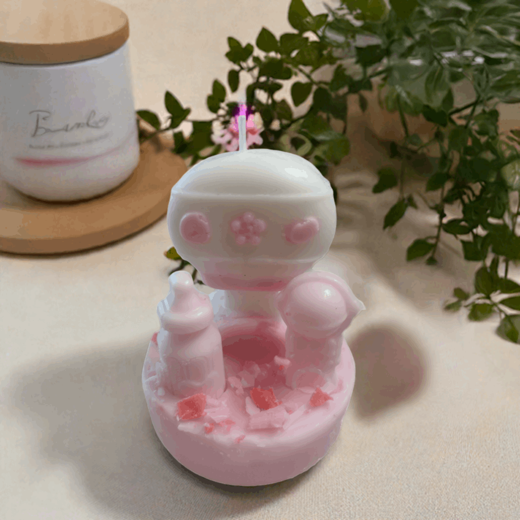 Long-lasting Pink Bot Rattle Candle for home decor and gifting by Scent Fushion.